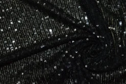 PAILLETTES CUCITE NERE SU FONDO TULLE STRETCH