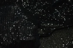 PAILLETTES CUCITE NERE SU FONDO TULLE STRETCH