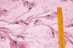 SCAMPOLO BROCCATO FIORE STILIZZATO FONDO ROSA