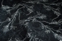 TESSUTO BROCCATO FIORE STILIZZATO FONDO NERO