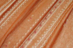 TESSUTO DOPPIA ORGANZA ARANCIO CON FIORE RICAMATO