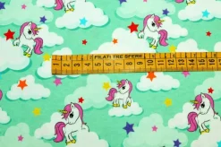 TESSUTO MAGLINA COTONE FANTASIA UNICORNO TURCHESE