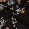 TESSUTO MAGLINA IN VISCOSA FANTASIA FLOREALE FONDO NERO