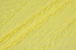 TESSUTO MAGLINA OPERATA ROMBO IN RILIEVO GIALLO