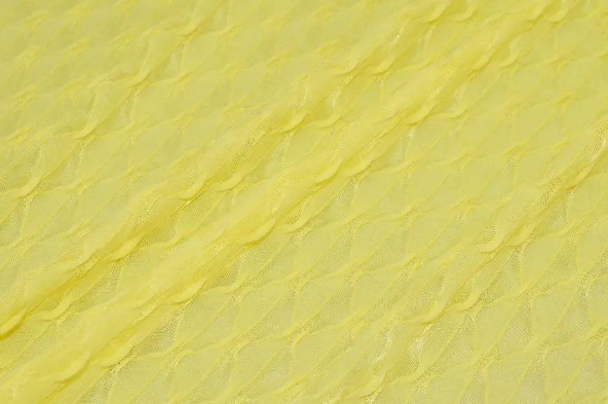 TESSUTO MAGLINA OPERATA ROMBO IN RILIEVO GIALLO