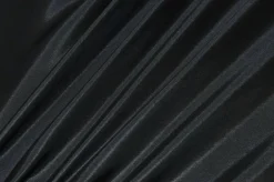 TESSUTO NERO CON APPLICAZIONI CUCITE E UNITO COORDINATO