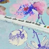 TESSUTO RASATELLO PURA VISCOSA FANTASIA FONDO AZZURRO